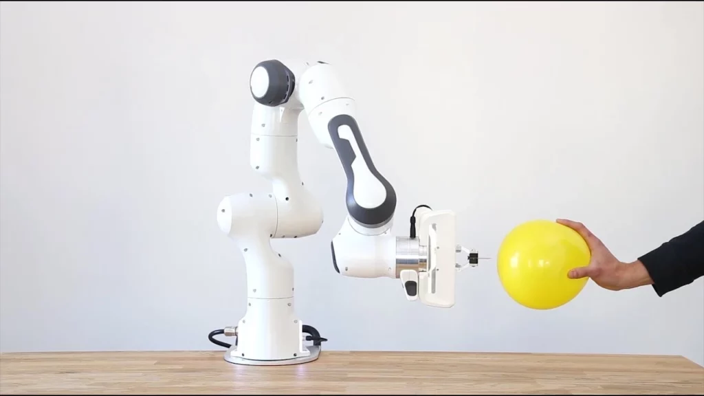 Franka panda robot with a yellow balloon
